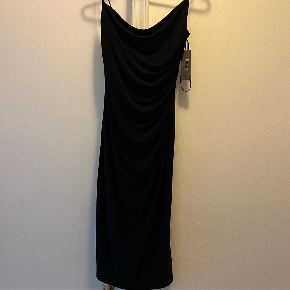 Perfect little black dress with spaghetti straps. Unworn tags still on.
